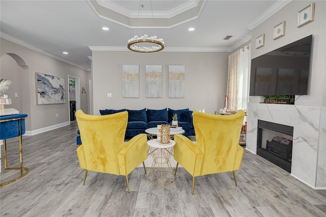 living room featuring visible vents, recessed lighting, a fireplace, and wood finished floors