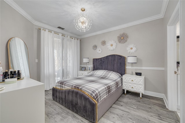 bedroom featuring light wood-type flooring, baseboards, visible vents, and ornamental molding