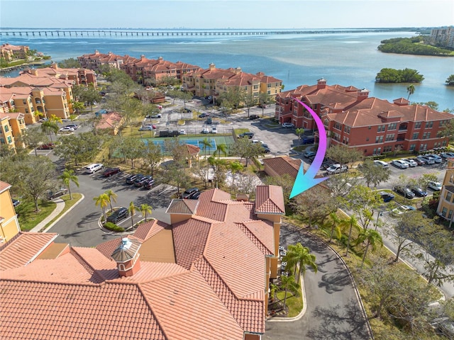 birds eye view of property featuring a residential view and a water view