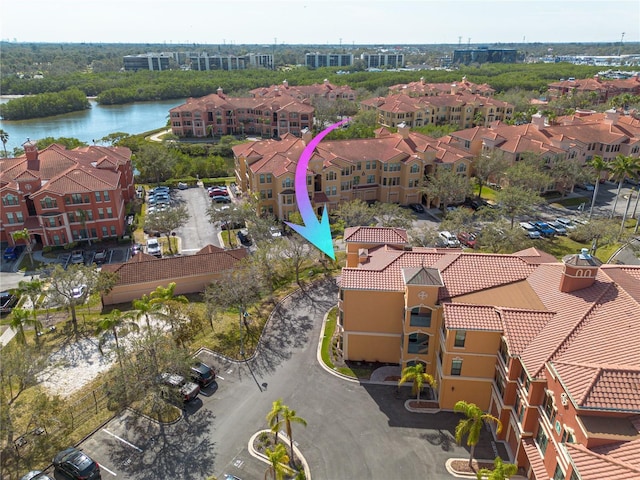 aerial view featuring a residential view and a water view