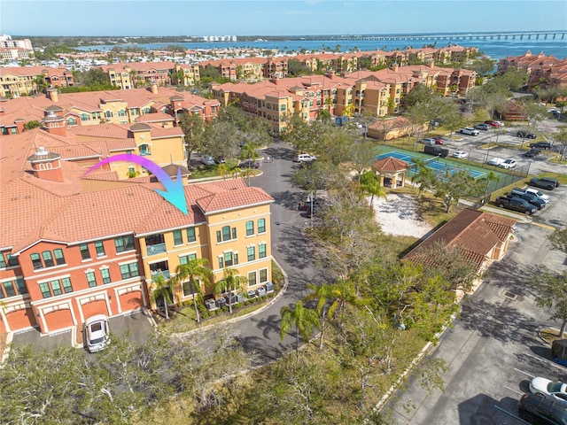 bird's eye view with a residential view and a water view