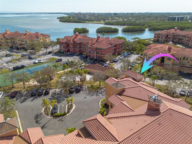 birds eye view of property with a water view