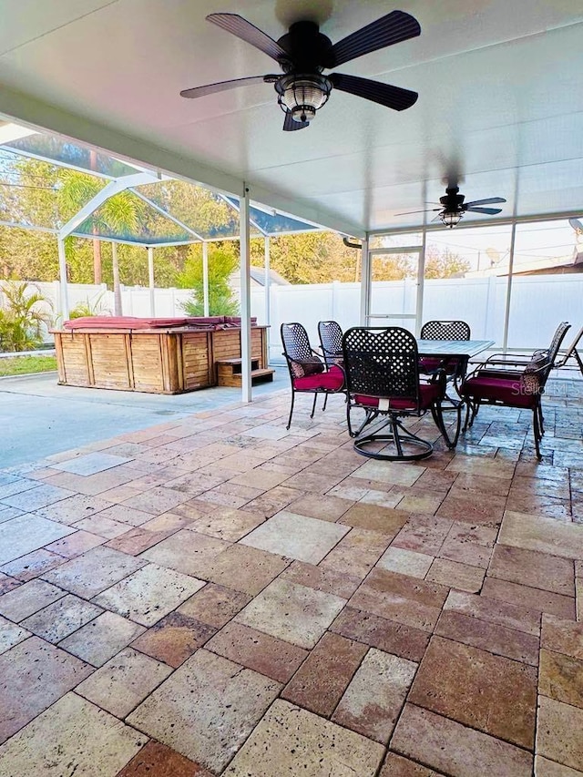 sunroom featuring ceiling fan