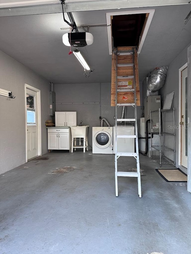 garage featuring washer / clothes dryer, sink, a garage door opener, and electric panel