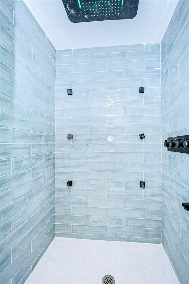 bathroom with a tile shower