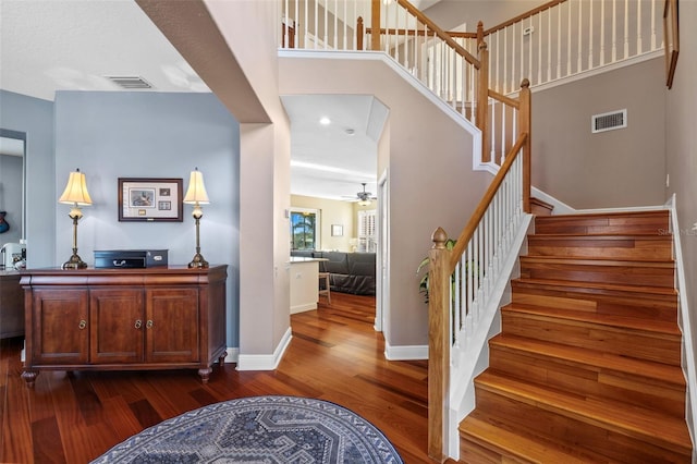 1881 Riveredge Dr, Tarpon Springs, FL 34689 - stairway with wood finished floors, baseboards, and ceiling fan