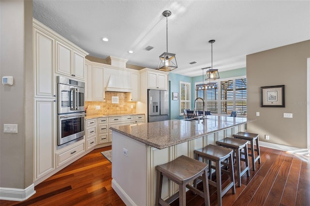 1881 Riveredge Dr, Tarpon Springs, FL 34689 - kitchen with appliances with stainless steel finishes, dark wood-style flooring, decorative backsplash, baseboards, and recessed lighting