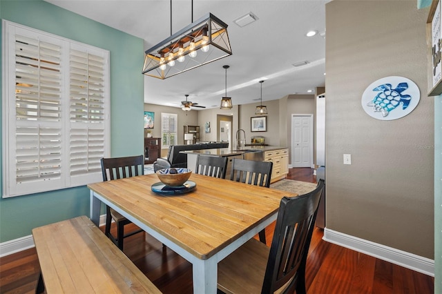 1881 Riveredge Dr, Tarpon Springs, FL 34689 - dining area featuring baseboards, dark wood-style flooring, ceiling fan, and recessed lighting