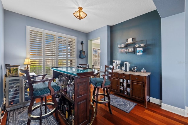1881 Riveredge Dr, Tarpon Springs, FL 34689 - bar area featuring dark wood finished floors and baseboards