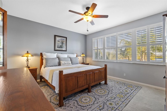 1881 Riveredge Dr, Tarpon Springs, FL 34689 - bedroom featuring baseboards, ceiling fan, and light carpet