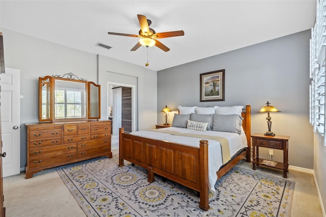 1881 Riveredge Dr, Tarpon Springs, FL 34689 - bedroom featuring light colored carpet, baseboards, and a ceiling fan