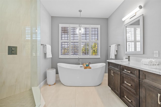 1881 Riveredge Dr, Tarpon Springs, FL 34689 - bathroom featuring walk in shower, a soaking tub, double vanity, and tile patterned flooring