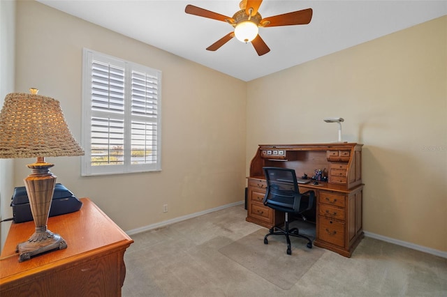 1881 Riveredge Dr, Tarpon Springs, FL 34689 - home office featuring light colored carpet, ceiling fan, and baseboards