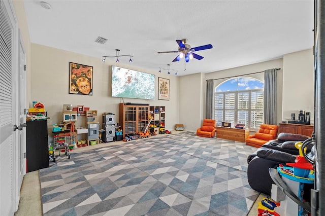 1881 Riveredge Dr, Tarpon Springs, FL 34689 - game room featuring a ceiling fan, rail lighting, and carpet floors