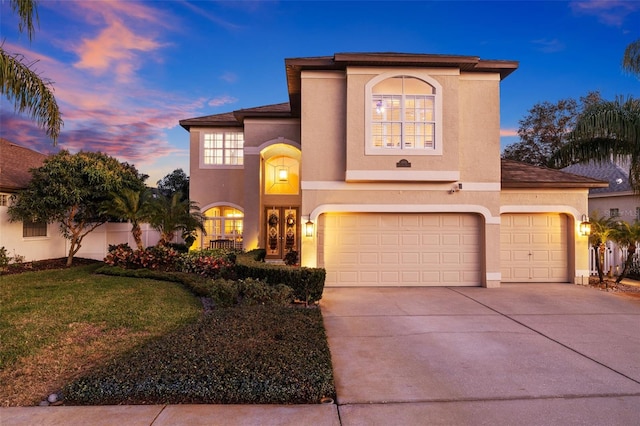 1881 Riveredge Dr, Tarpon Springs, FL 34689 - mediterranean / spanish-style home with stucco siding, concrete driveway, a garage, and a lawn
