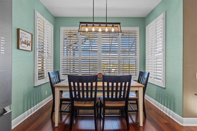 1881 Riveredge Dr, Tarpon Springs, FL 34689 - dining space featuring baseboards and wood finished floors