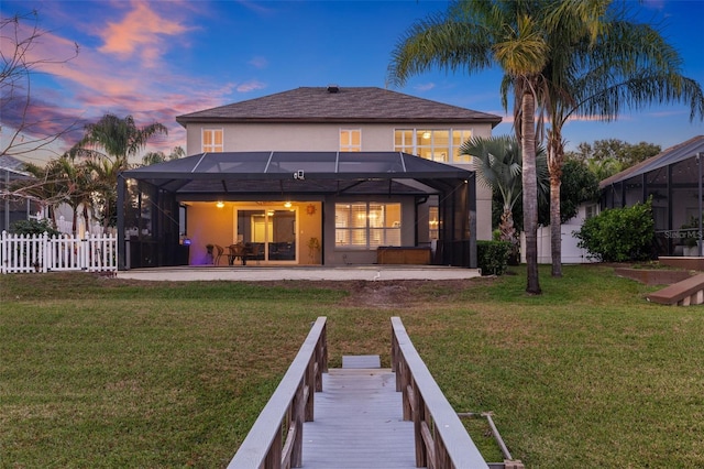 1881 Riveredge Dr, Tarpon Springs, FL 34689 - back of house with stucco siding, a lanai, and a patio