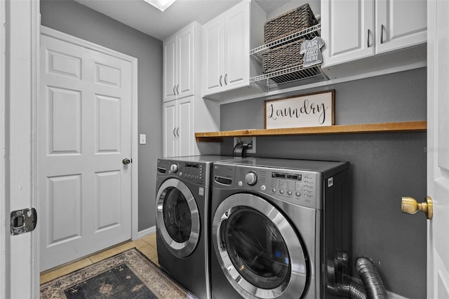 1881 Riveredge Dr, Tarpon Springs, FL 34689 - laundry area featuring cabinet space, washing machine and clothes dryer, baseboards, and light tile patterned floors