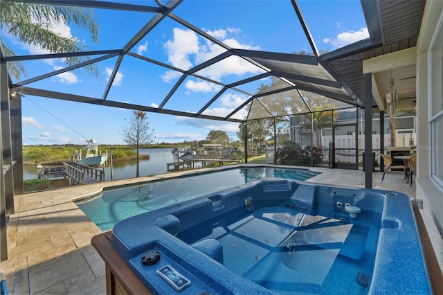 1881 Riveredge Dr, Tarpon Springs, FL 34689 - outdoor pool with a water view, a hot tub, a patio area, and boat lift
