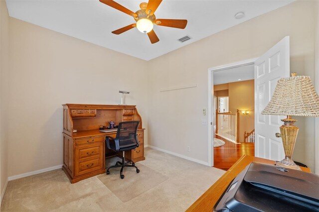 1881 Riveredge Dr, Tarpon Springs, FL 34689 - office area featuring light carpet, a ceiling fan, and baseboards