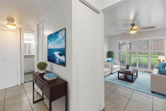 interior space with ceiling fan