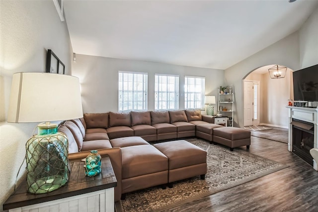 living room with lofted ceiling and hardwood / wood-style flooring