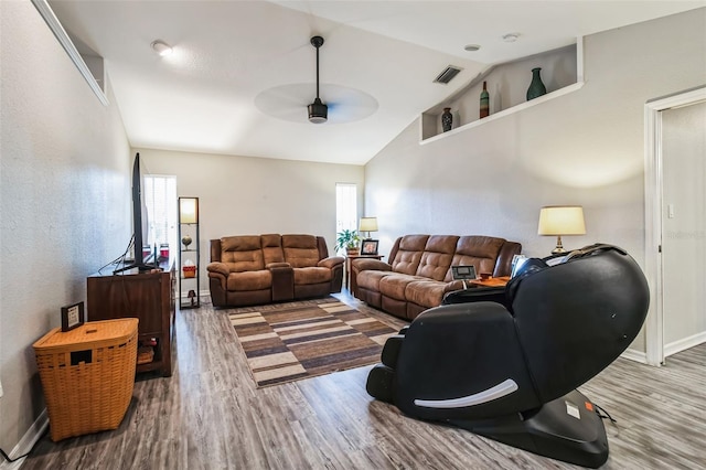 living room with wood-type flooring, high vaulted ceiling, and ceiling fan