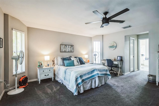 carpeted bedroom with ceiling fan and vaulted ceiling