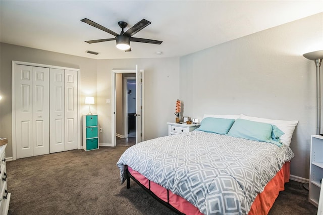 bedroom featuring ceiling fan, dark carpet, and a closet