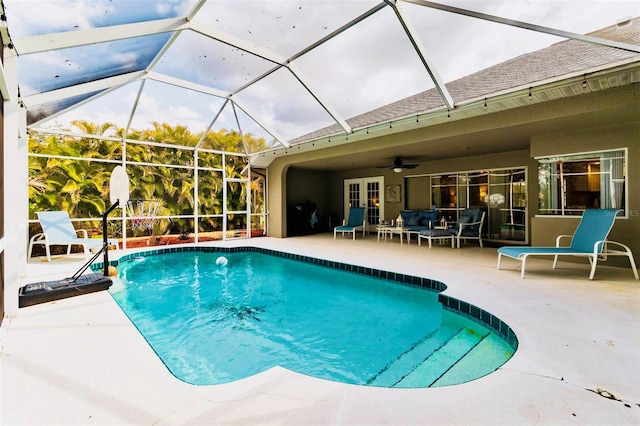 view of swimming pool with an outdoor living space, a patio, a lanai, and ceiling fan