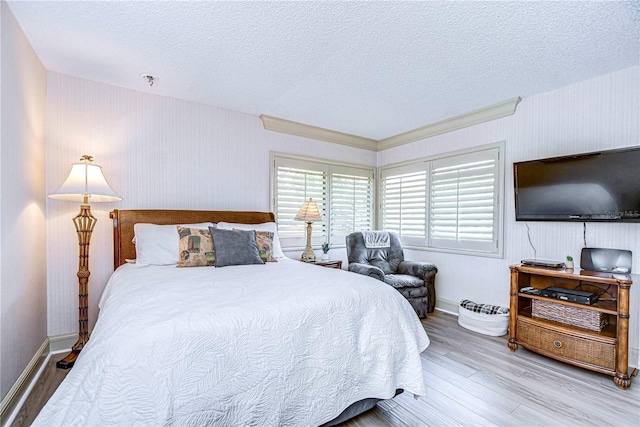 bedroom featuring wood-type flooring and a textured ceiling