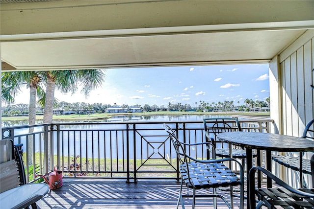 wooden terrace with a water view