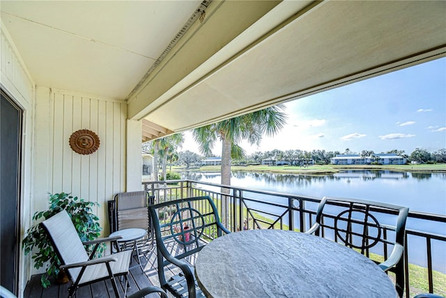 balcony featuring a water view