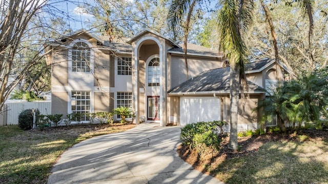 view of front of home featuring a garage and a front yard