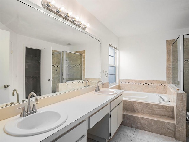 bathroom featuring vanity, independent shower and bath, and tile patterned flooring