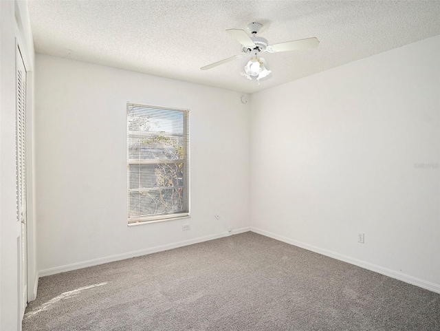 interior space featuring ceiling fan and a textured ceiling