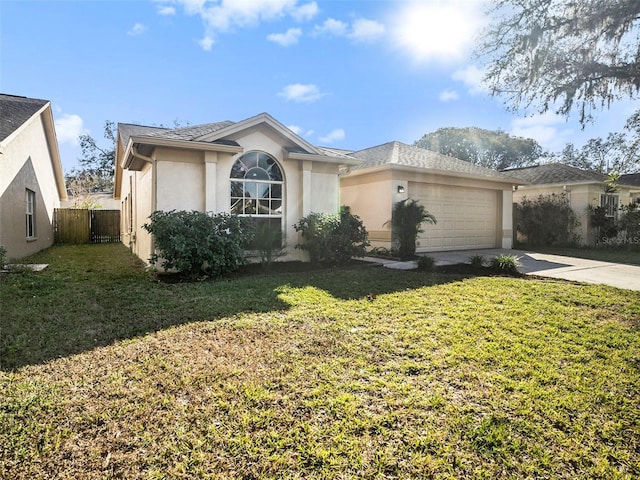 ranch-style house with a garage and a front lawn