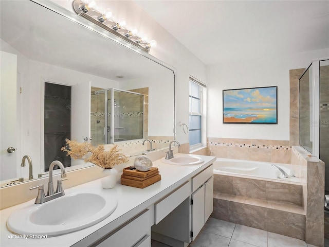 bathroom with tile patterned flooring, vanity, and independent shower and bath