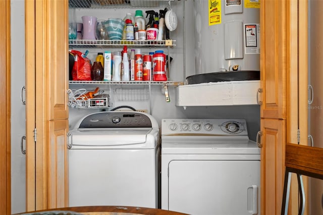 laundry area featuring separate washer and dryer and water heater