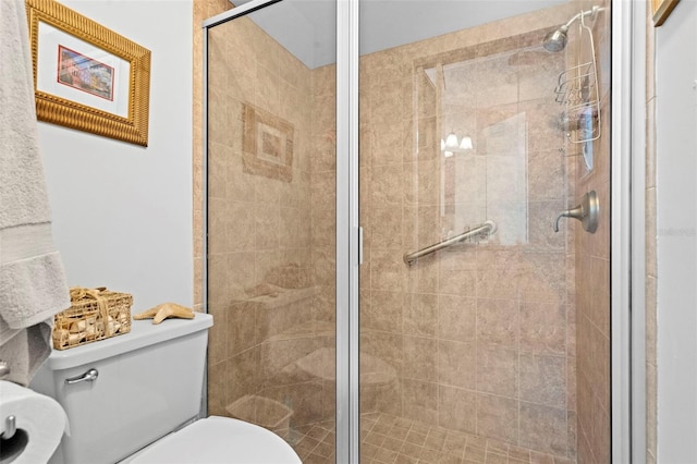 bathroom with an enclosed shower and toilet