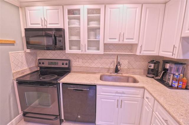 kitchen featuring white cabinetry, backsplash, sink, and black appliances