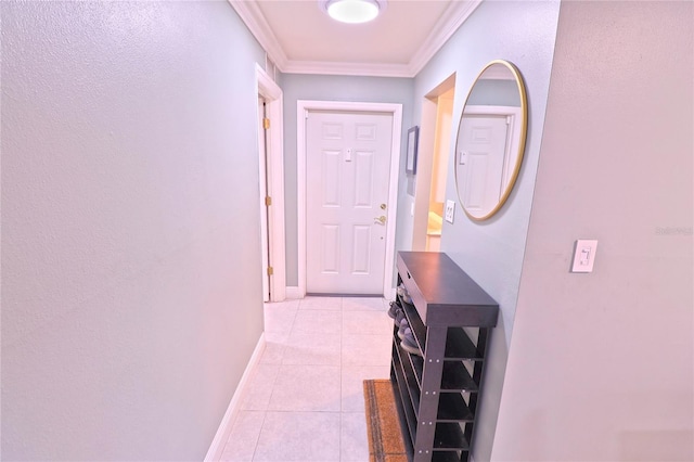 hallway featuring ornamental molding and light tile patterned floors