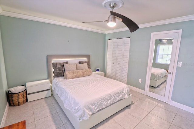 tiled bedroom featuring ornamental molding, a closet, and ceiling fan