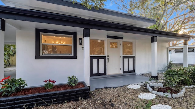 doorway to property with a porch