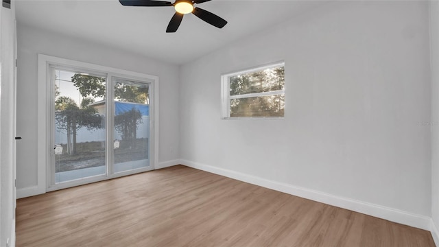 spare room featuring ceiling fan, plenty of natural light, and light hardwood / wood-style floors