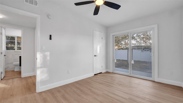 unfurnished room featuring ceiling fan and light wood-type flooring