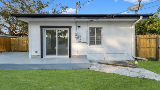 exterior space with a yard and a patio area