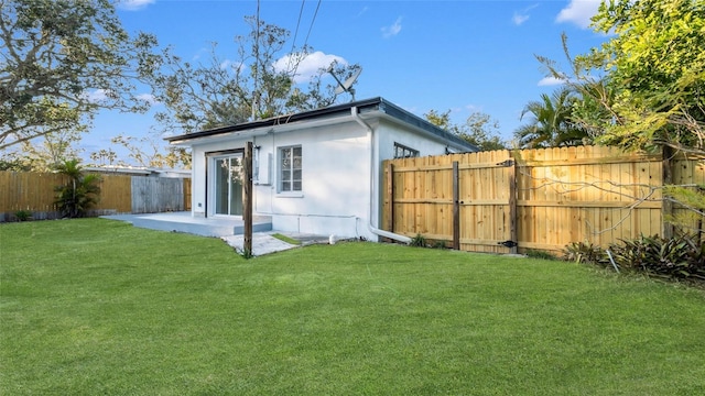 exterior space with a yard and a patio area