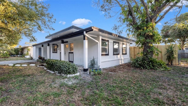 view of side of property with a porch