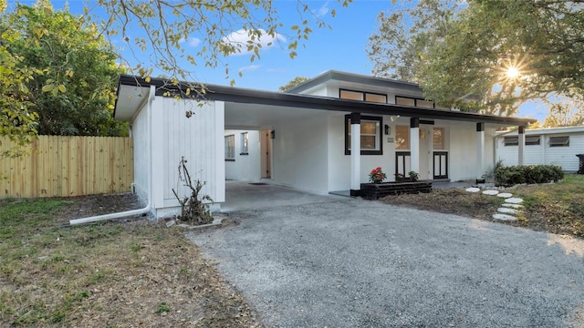 view of front of property with a carport and covered porch